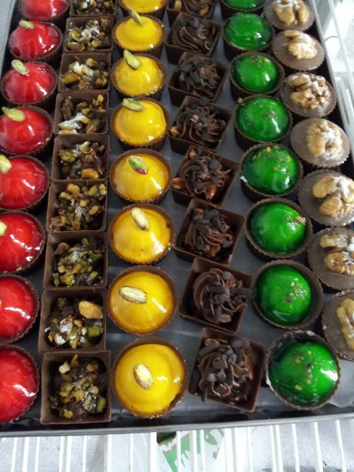 Premium Belgian chocolate tray with pistachio, mango and walnut varieties